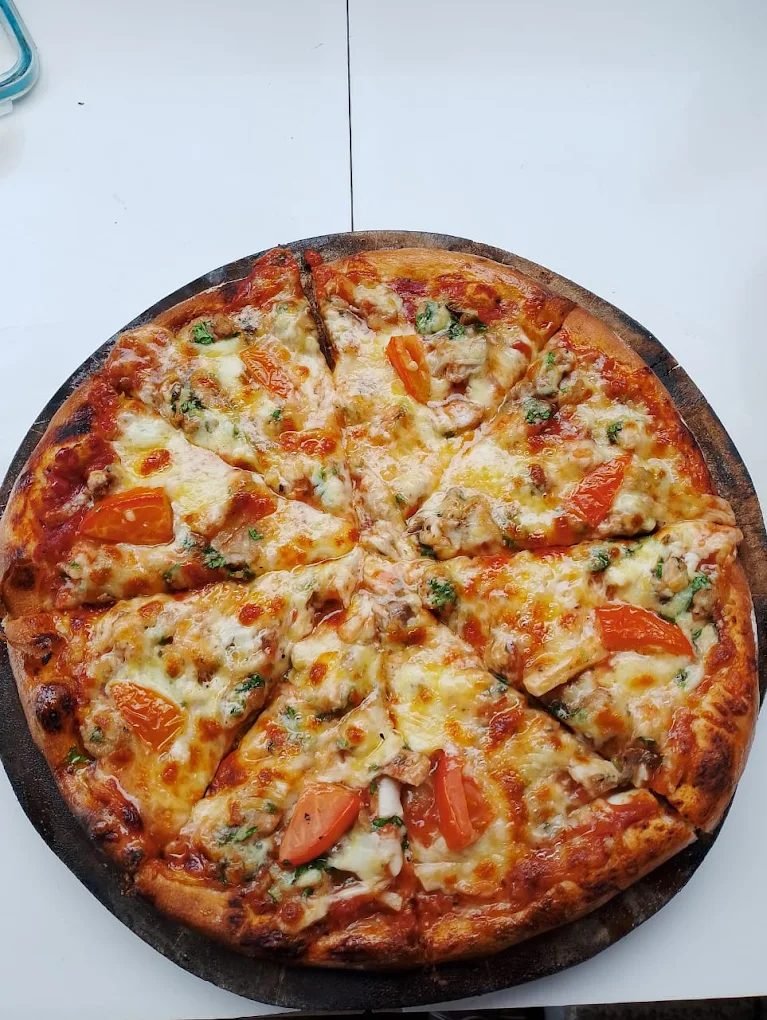 Wood-fired seafood pizza at The Dining Room, East Bali