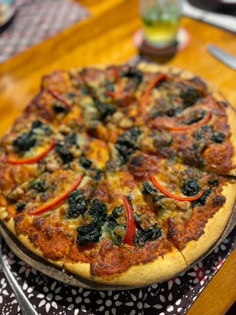 Wood-fired vegetarian pizza with spinach and chilli at The Dining Room Candidasa